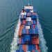 Aerial view container cargo ship, import export commerce global business trade logistic and transportation of worldwide by container cargo ship boat in the open sea, Freight shipping maritime.