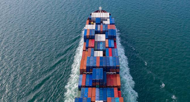 Aerial view container cargo ship, import export commerce global business trade logistic and transportation of worldwide by container cargo ship boat in the open sea, Freight shipping maritime.